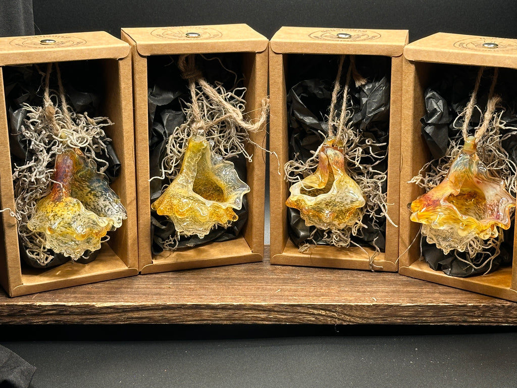 Hand-sculpted glass conch shell hanging planters in gift-ready premium packaging by Unclefish.